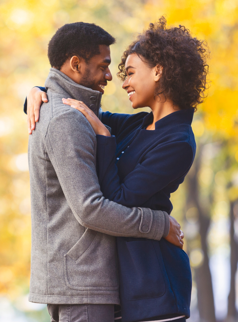 Happy couple - relationship coaching - hugging- vertical